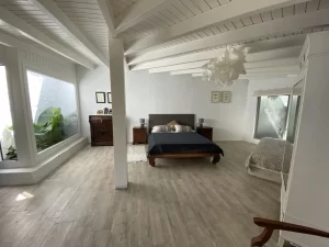 Spacious bedroom with a white timber-beamed ceiling at Villa Almar in Tarifa
