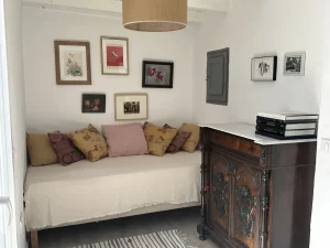 Daybed with patterned cushions and an antique chest at Villa Almar in Tarifa