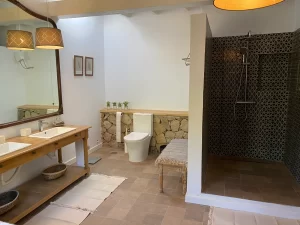Bathroom with double wooden vanity and walk-in shower at Villa Almar in Tarifa
