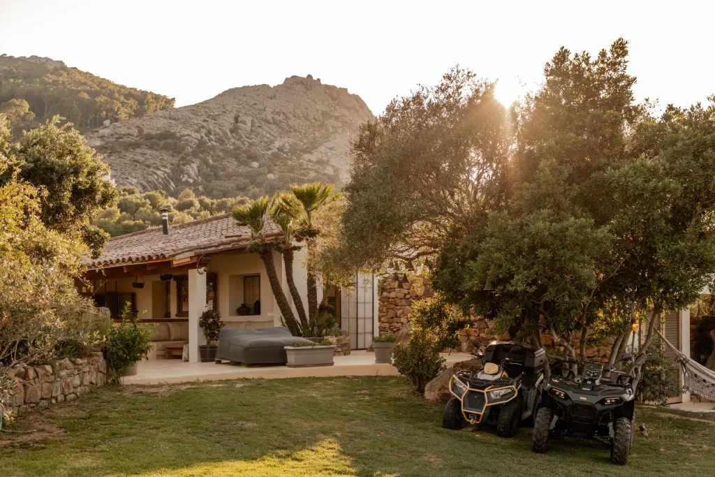 Villa Gran Paraiso exterior at golden hour with mountain backdrop