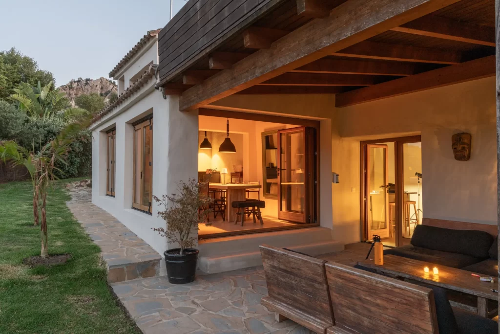 Villa Gran Paraiso exterior at dusk with illuminated dining room