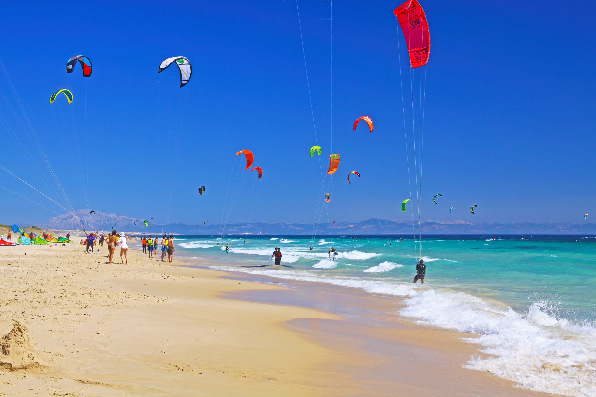 Kitesurfing in Tarifa with Africa visible across the Strait